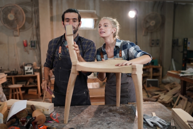 Two People Making A Stool